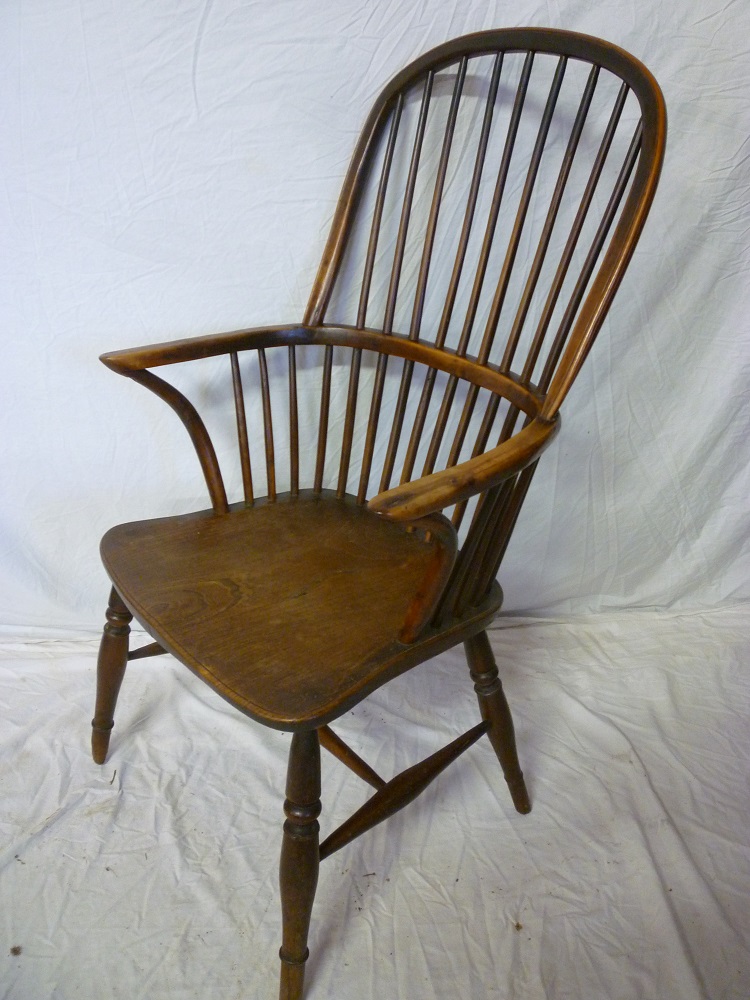 A 19th century Westcountry yew and elm Windsor armchair with spindle back and seat on turned