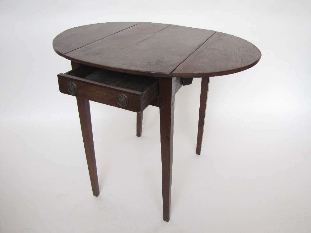 A George III mahogany Pembroke table, oval top over a frieze drawer, raised on tapered square