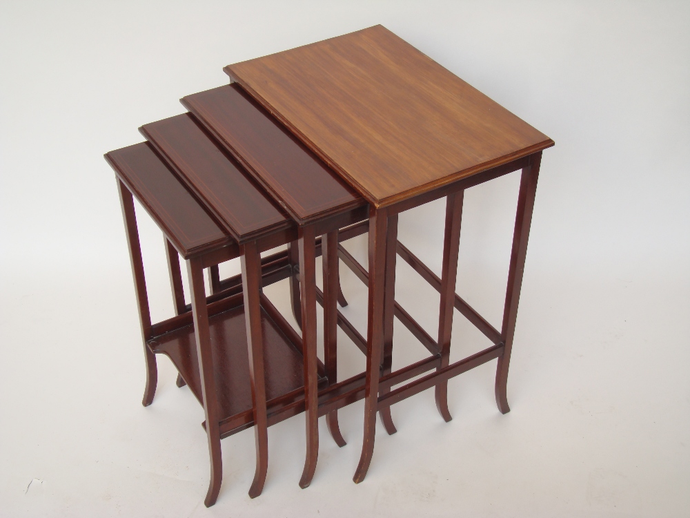 An Edwardian mahogany quartetto nest of occasional tables, each graduated with rectangular top