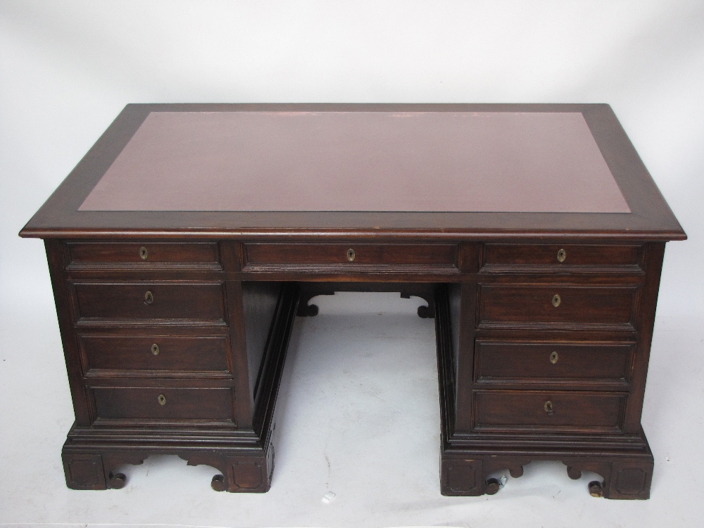 A late 19th century Northern Italian walnut pedestal desk.
The rectangular moulded edge top inset