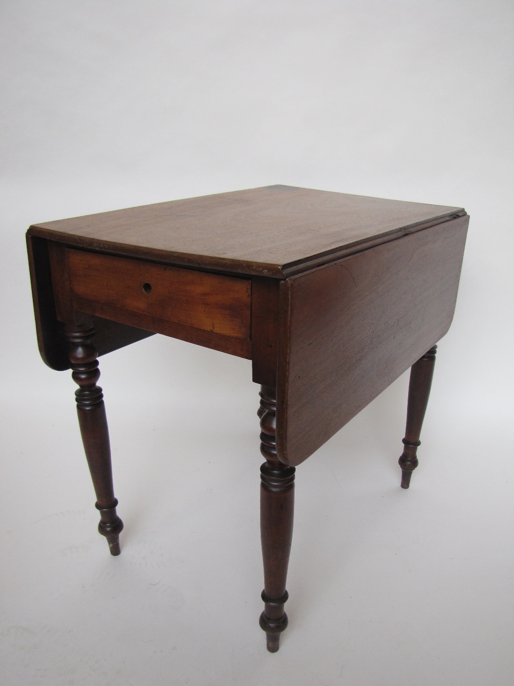 An early Victorian mahogany Pembroke table.