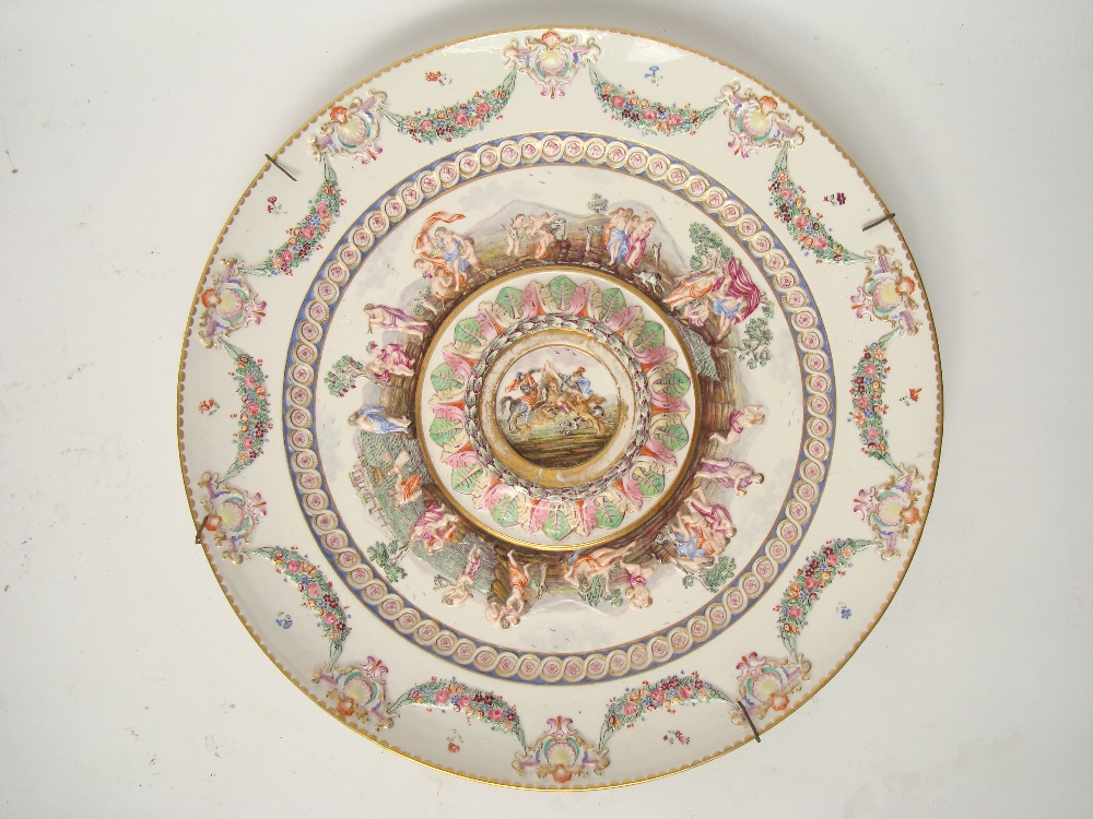 A late 19th century Capodimonte style polychrome relief stand.
The central raised roundel