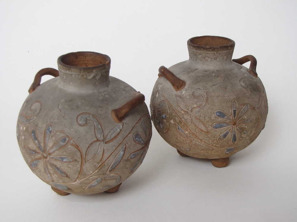 A pair of late 19th Century Brannam Pottery small globular vases, the body decorated with