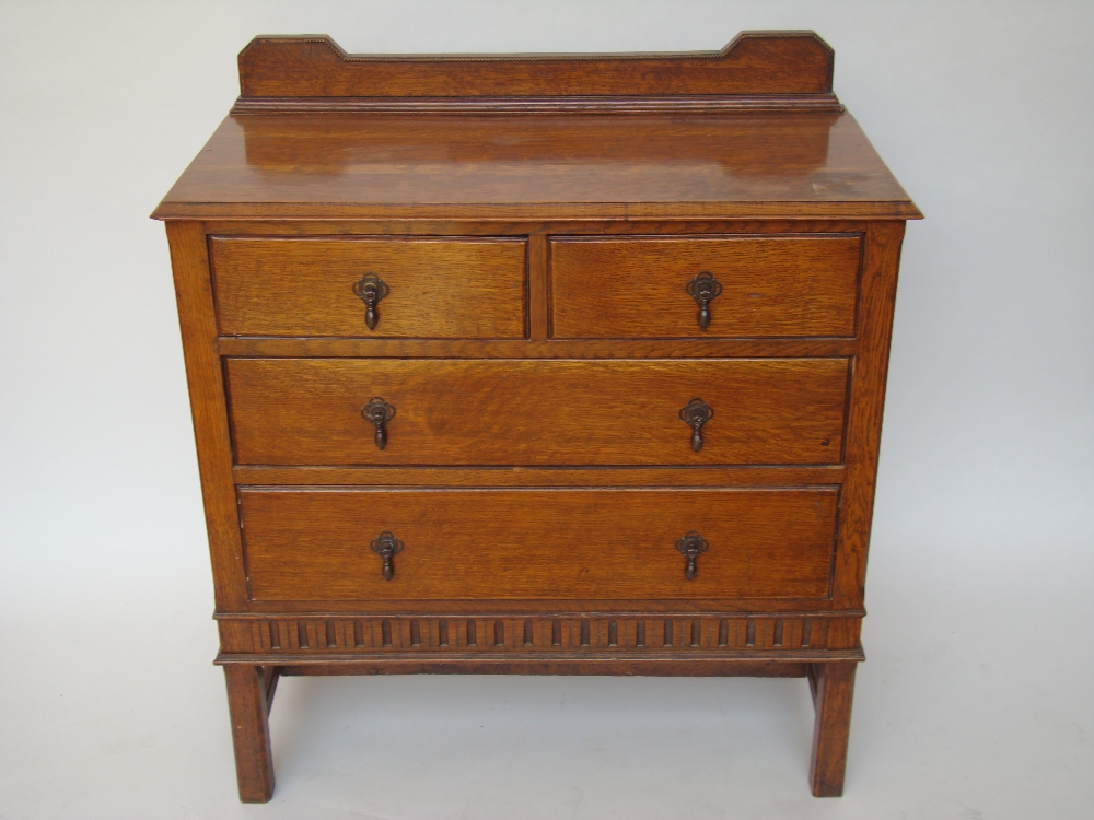 An 1920's oak chest of drawers with two short and three long drawers.