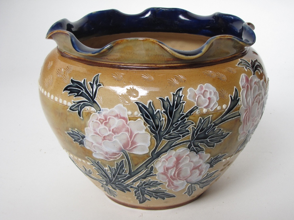 A Royal Doulton jardiniere.
Of bulbous form with flared rim, with tube lined decoration with