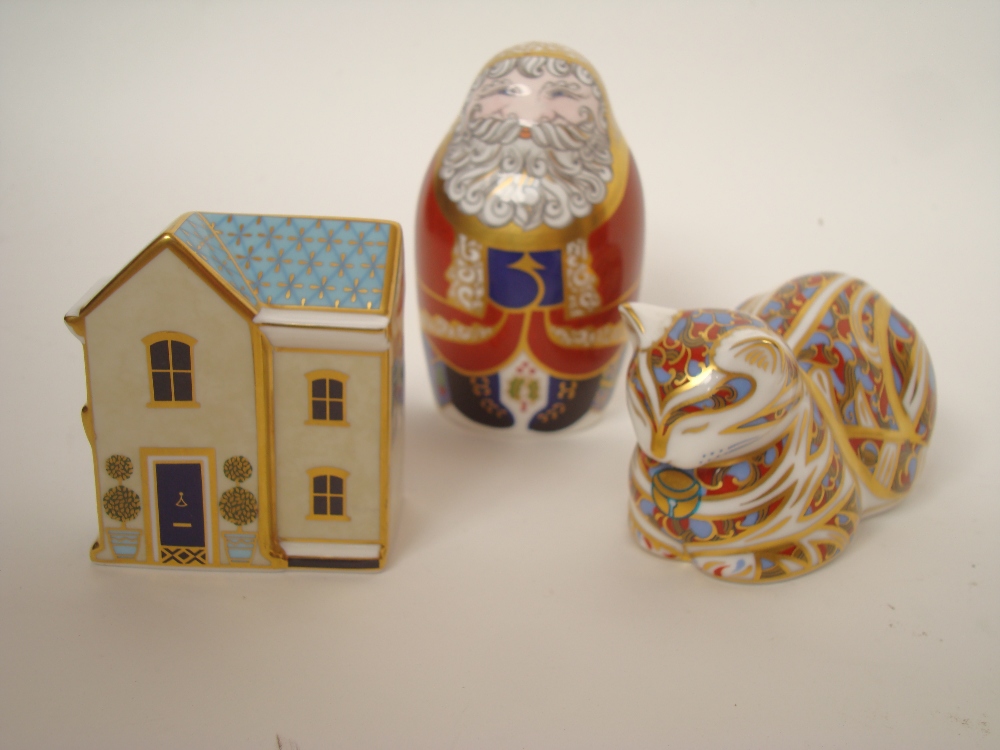 A Royal Crown Derby paperweight "Father Christmas" pattern LXI, red printed marks, silver stopper. A