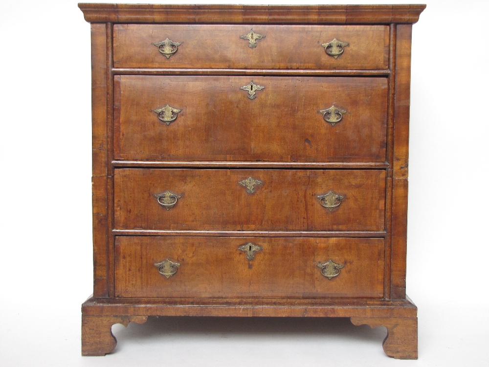 A William and Mary/Queen Anne walnut and oak two section chest of drawers.
The rectangular top