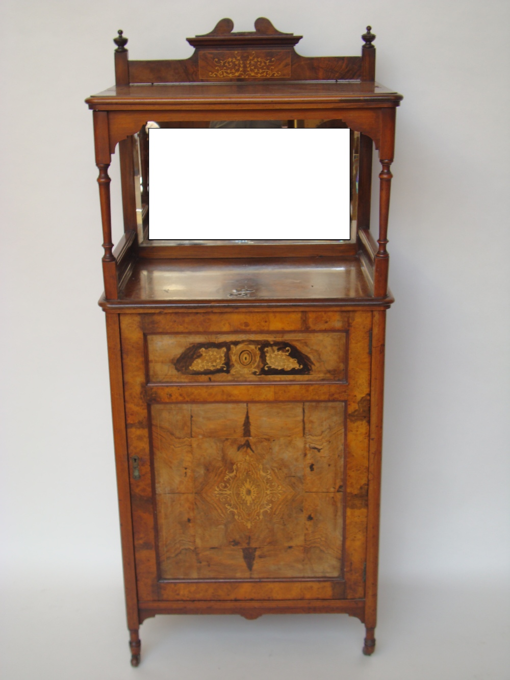 A mid Victorian figured walnut and marquetry music cabinet, the open superstructure with mirror