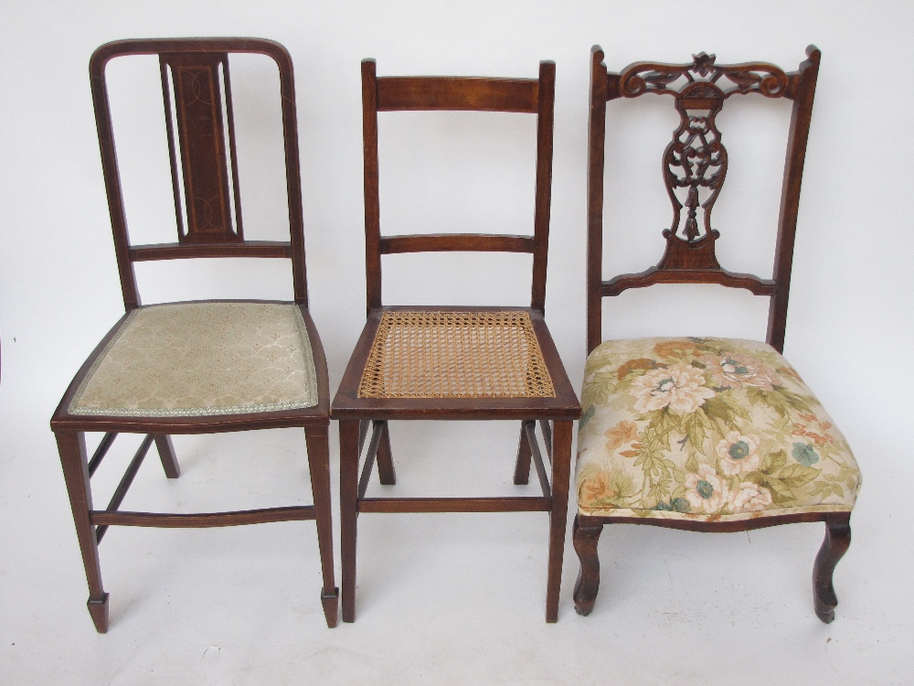 A Victorian walnut bedroom chair, an Edwardian mahogany side chair and another chair with caned seat