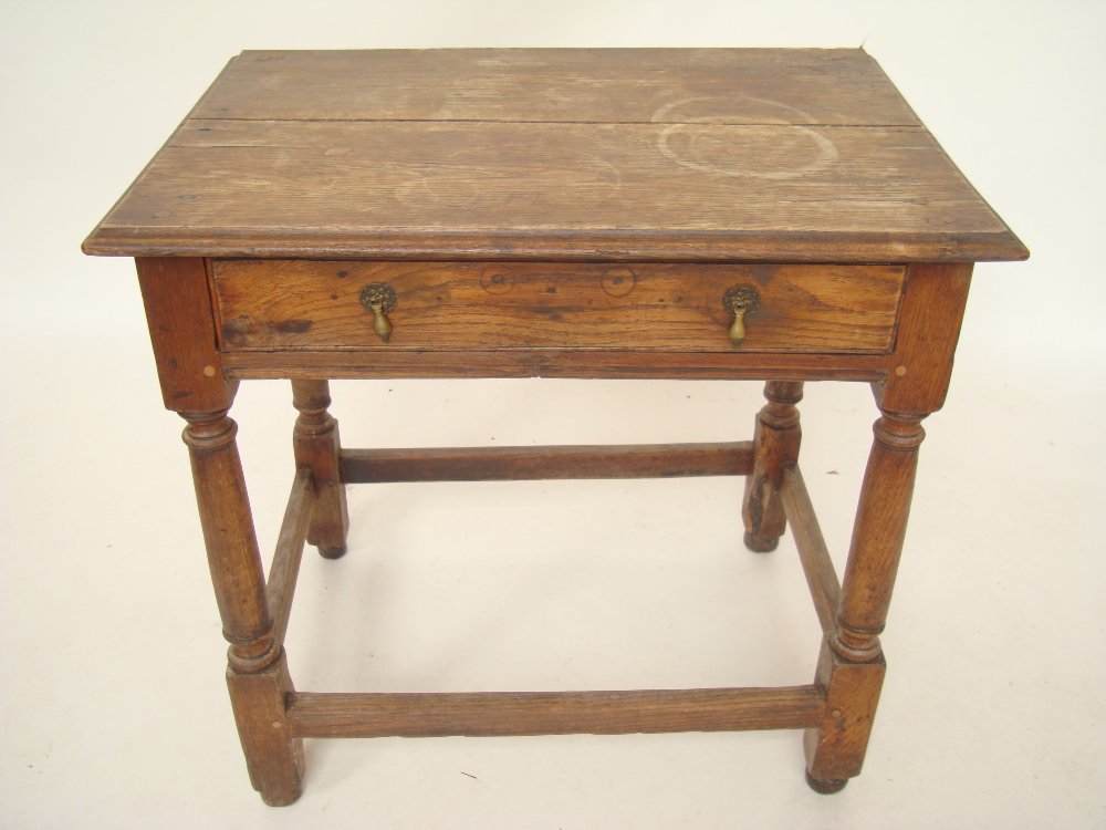 An 18th Century, Queen Anne oak and elm side table, the rectangular two plank top with moulded