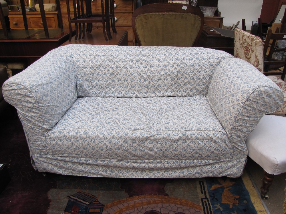 An Edwardian drop end Chesterfield sofa with William Morris design loose covers