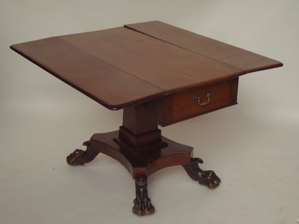 An early 19th Century mahogany pembroke table, the rectangular top with twin hinged flaps, frieze