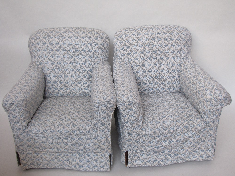 A pair of Edwardian upholstered armchairs, with William Morris design loose covers