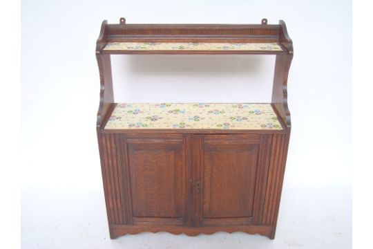 An Edwardian oak wall hanging cabinet, with open shelves over a pair of cupboard doors.