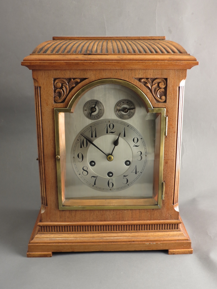 An early 20th Century mahogany bracket clock with quarter striking Westminster Junghans movement,