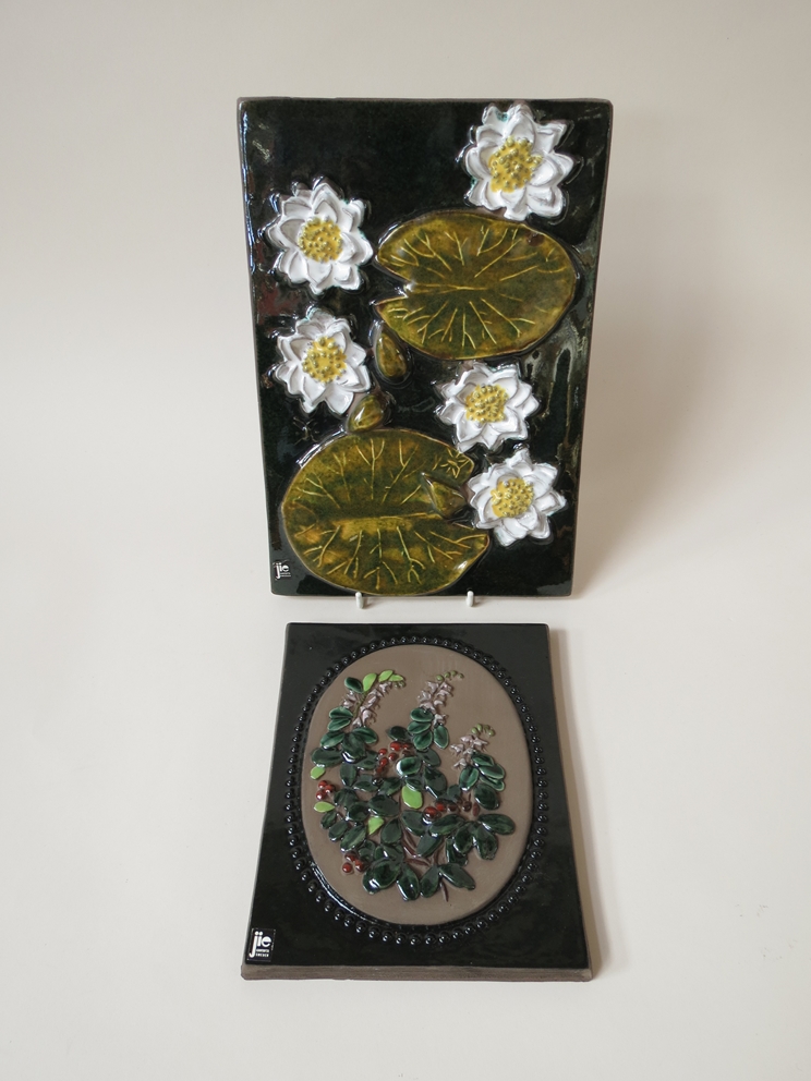 Two Jie ceramic wall plaques, floral scenes