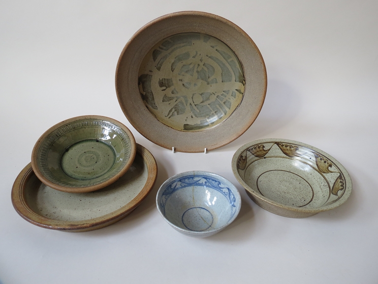 A collection of studio pottery bowls and dishes including Nora Braden (one a/f) and a Batterham