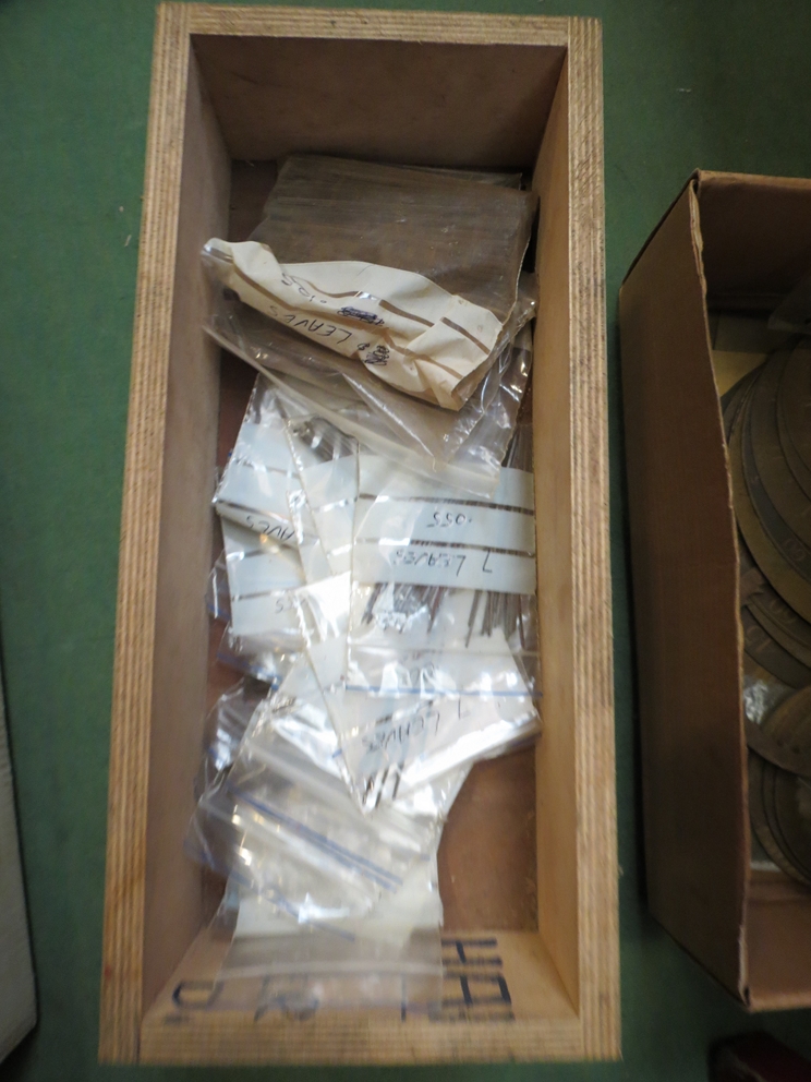 Three boxes of various sized steel pinion wire
