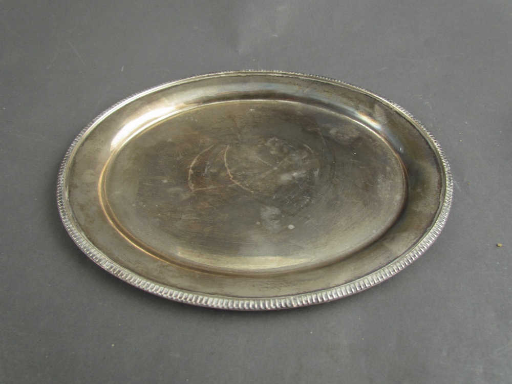 A silver oval waiter tray, Birmingham 1969, 19cm long