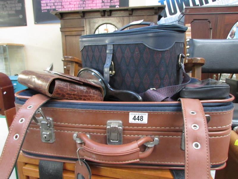 A suitcase, vanity case etc
