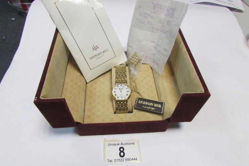 A Genuine Raymond Weil ladies wristwatch with certificate of origin and original purchase receipt