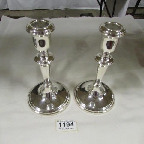 A pair of silver candlesticks