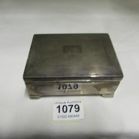 A silver cigarette box