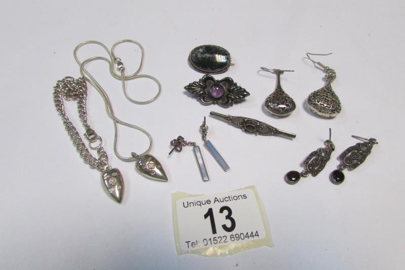 A silver heart pendant with matching bracelet, 2 brooches and 3 pairs of earrings