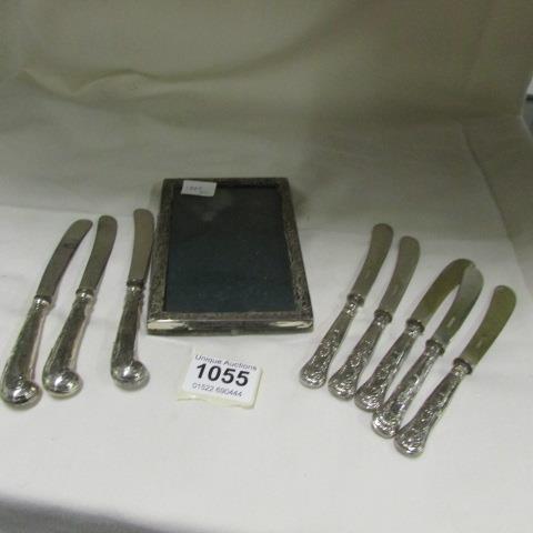8 HM silver handled knives (some a/f) and a silver photo frame a/f