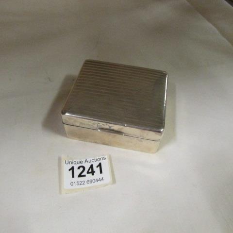 A silver cigarette box
