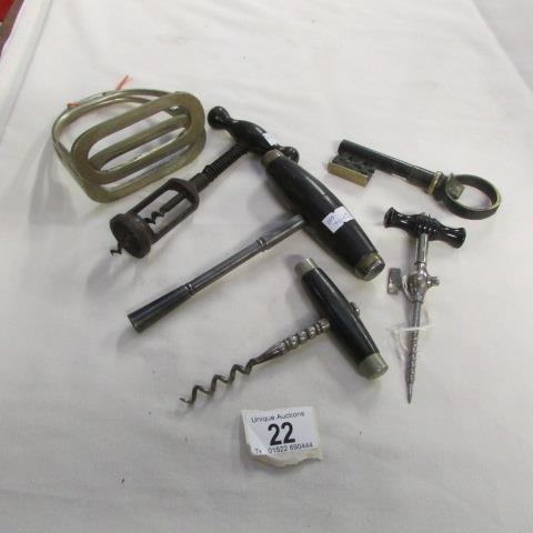 A collection of corkscrews including champagne tap