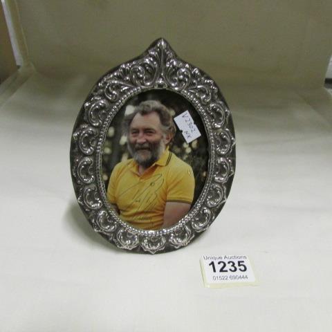 A silver photo frame hallmarked London 1978 with a signed photo of David Bellamy