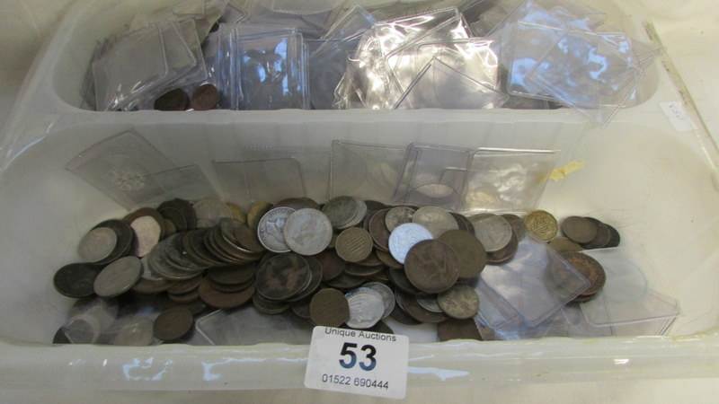 A large quantity of plastic coin cases and a mixed lot of coins