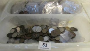 A large quantity of plastic coin cases and a mixed lot of coins
