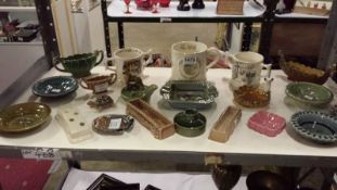 Shelf of Wade items inc Mugs, Ash Trays etc