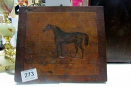A picture of  a horse on wooden panel