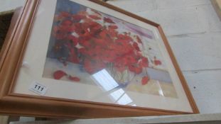 A framed and glazed poppy print