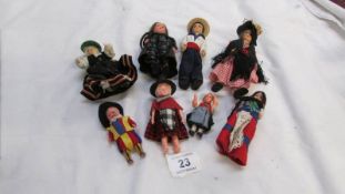 A small collection of costume dolls