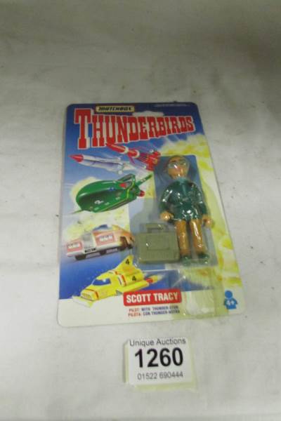 A wrong carded Matchbox Thunderbird figure, Brains on a Scott Tracy card