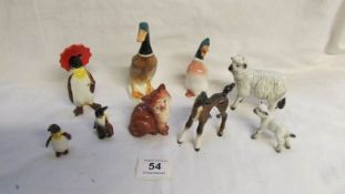 A collection of 9 Beswick animals including penguins, sheep, ducks etc