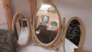 A triple dressing table mirror