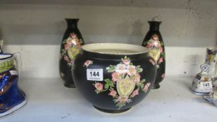 A Crown Devon jardiniere and pair of matching vases
