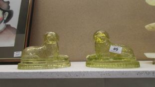 A pair of Victorian Uranium glass dogs (one a/f)