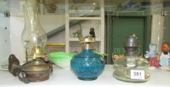 2 glass oil lamp fonts and a brass 'gimbal' oil lamp