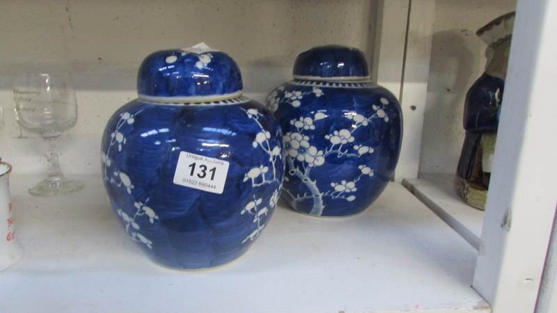 A pair of large Oriental blue and white ginger jars