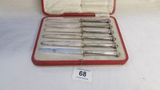 A cased set of 6 silver handled knives