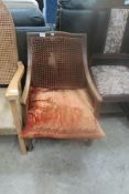 An Edwardian armchair with cane back