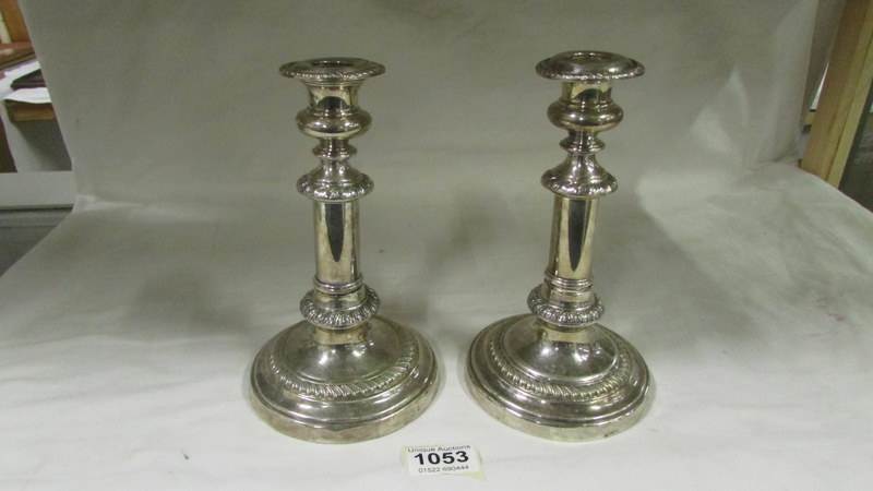 A pair of silver plate extending candlesticks