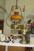 A hanging lamp and an oil lamp