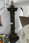 A carved wood Corinthian style table lamp base